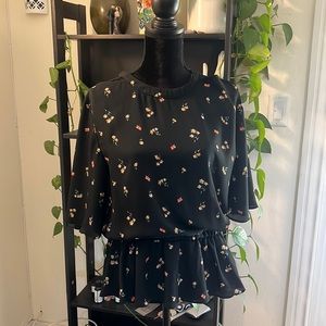 Black and floral blouse with small shoulder and back cut out